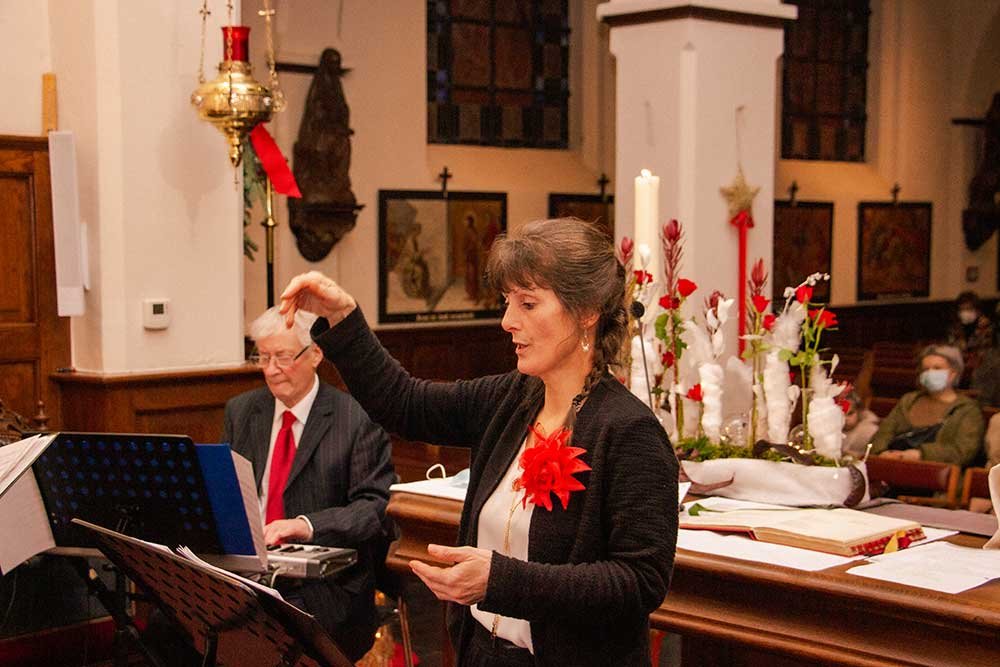 seniorenkoor kerstviering dirigente